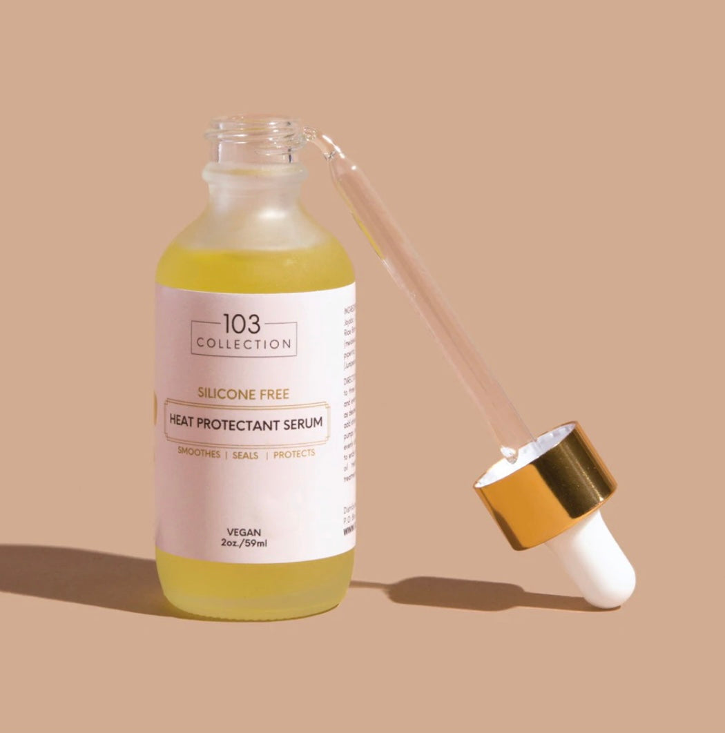 Vegan Heat Protectant Serum bottle with dropper, cruelty-free formula for hair protection and shine, by 103 Collection.