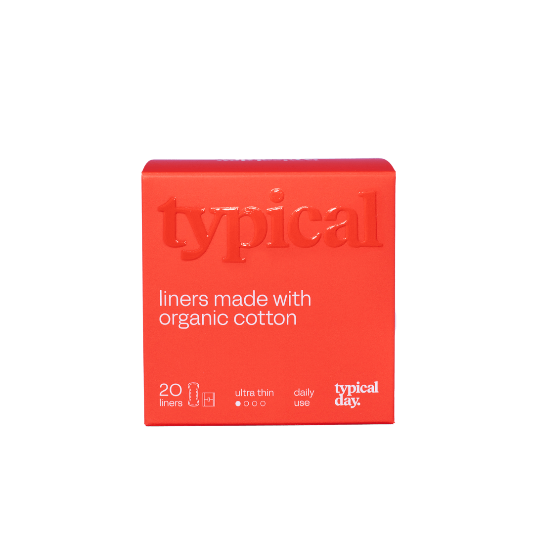 Bright orange box of organic cotton panty liners for daily freshness, breathable and fragrance-free