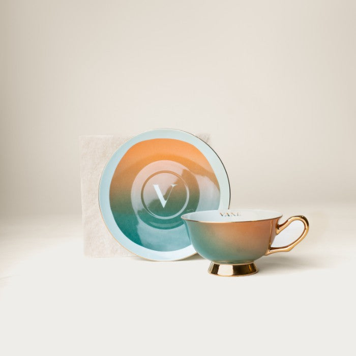 Ombré Tea Set with haint blue cup and saucer designed by Lynae Vanee, symbolizing protection and peace from Gullah-Geechee heritage.