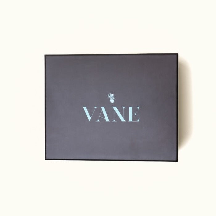 Packaging box for Vanee's Haint Blue Tea Set featuring elegant black design with branding