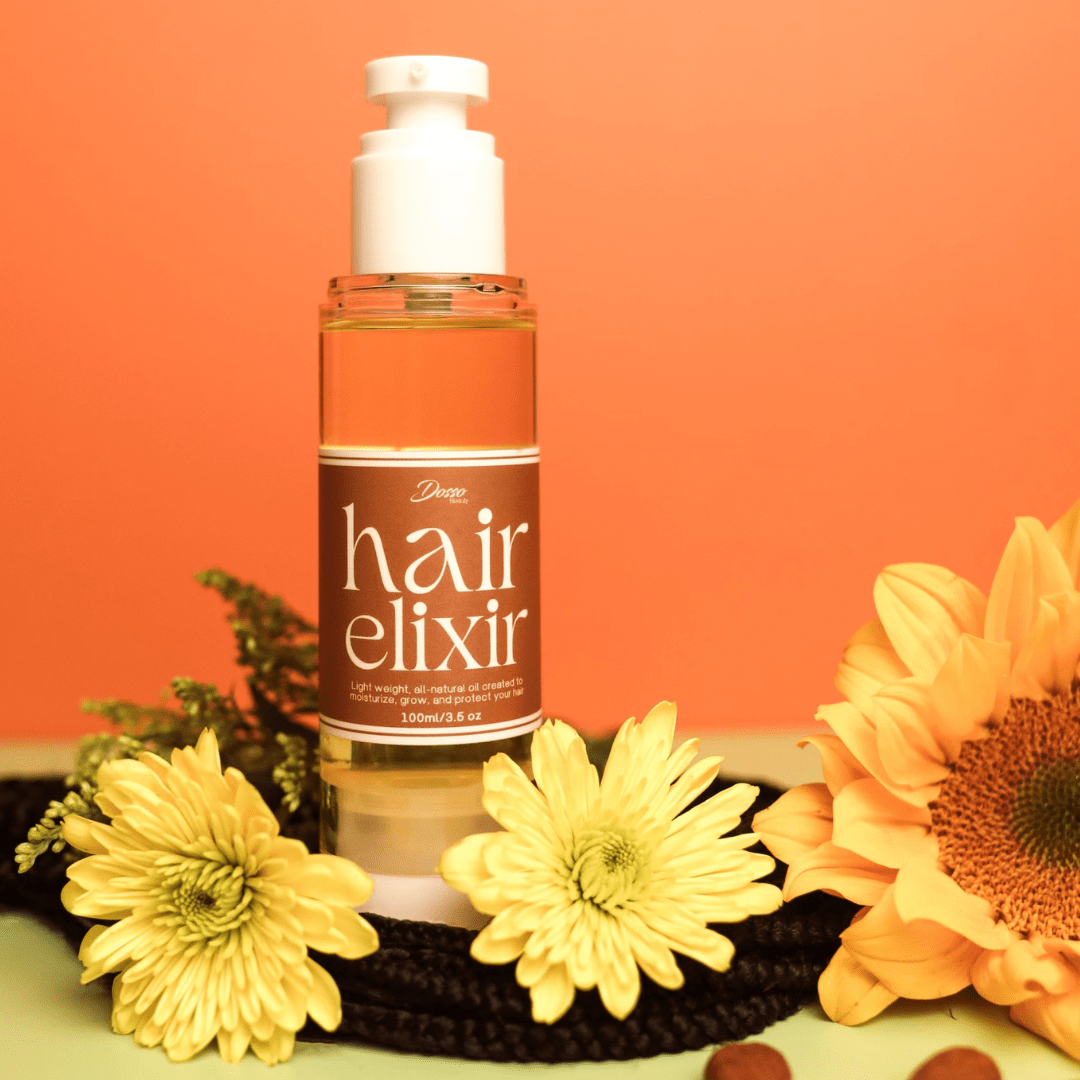 Dosso Beauty Hair Elixir bottle surrounded by sunflowers, features nourishing oil blend for healthy, soft hair. BPA-free dispenser, 3.5 oz.