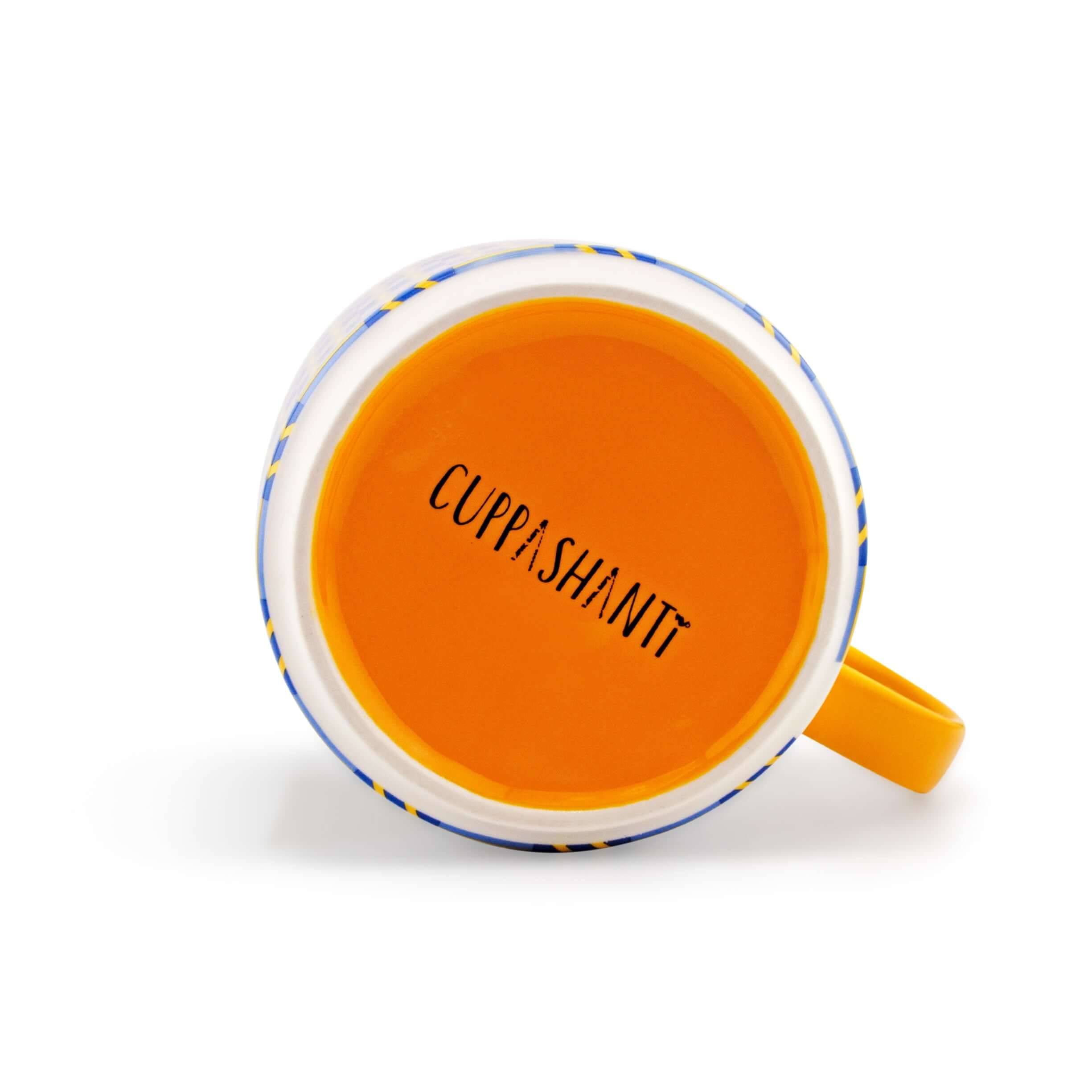 Top view of a Kente-inspired mug with orange interior and unique patterns, showcasing cultural design and bold expression.